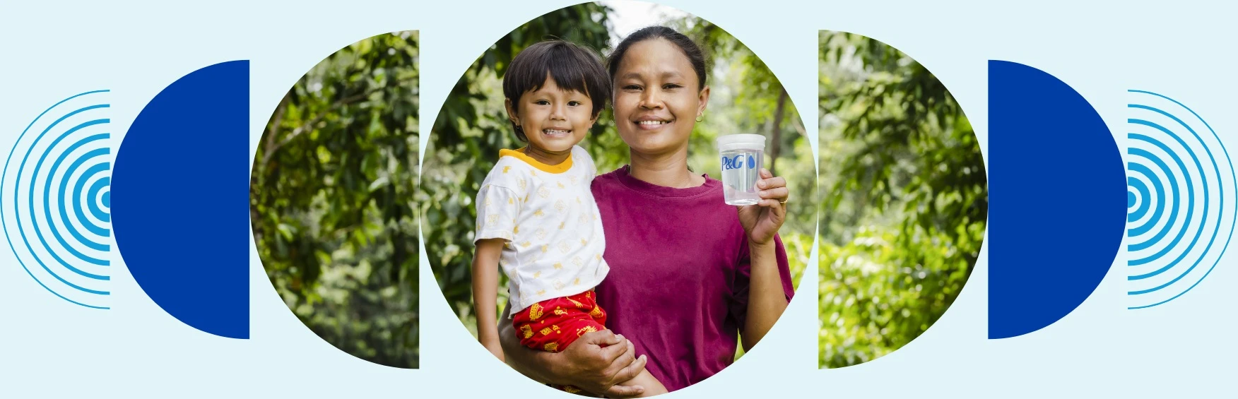 A mother in a pink shirt smiles as she holds her child with a giant grin in one hand and a P&G branded cup of clean water in her other hand
