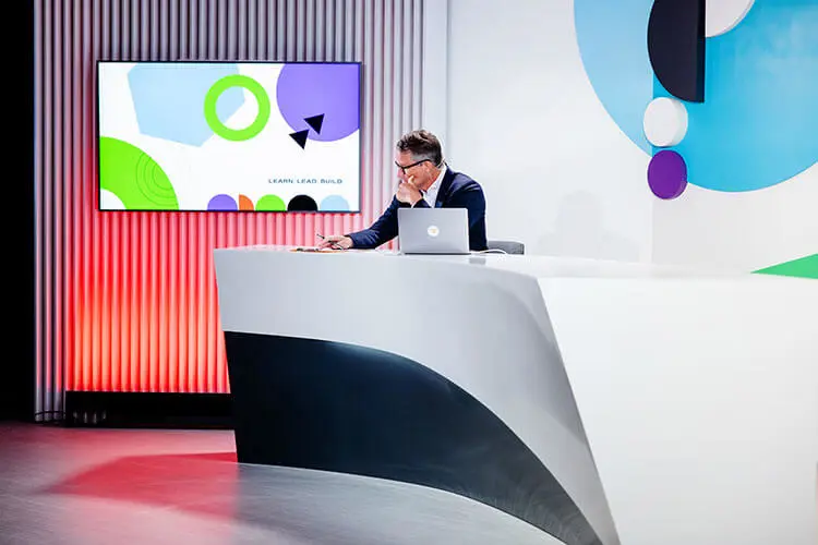 Man sitting by the desk with a laptop on Signal Recap