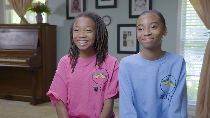 13-year-old sisters Brooke and Breanna Bennett getting interviewed about their donation efforts