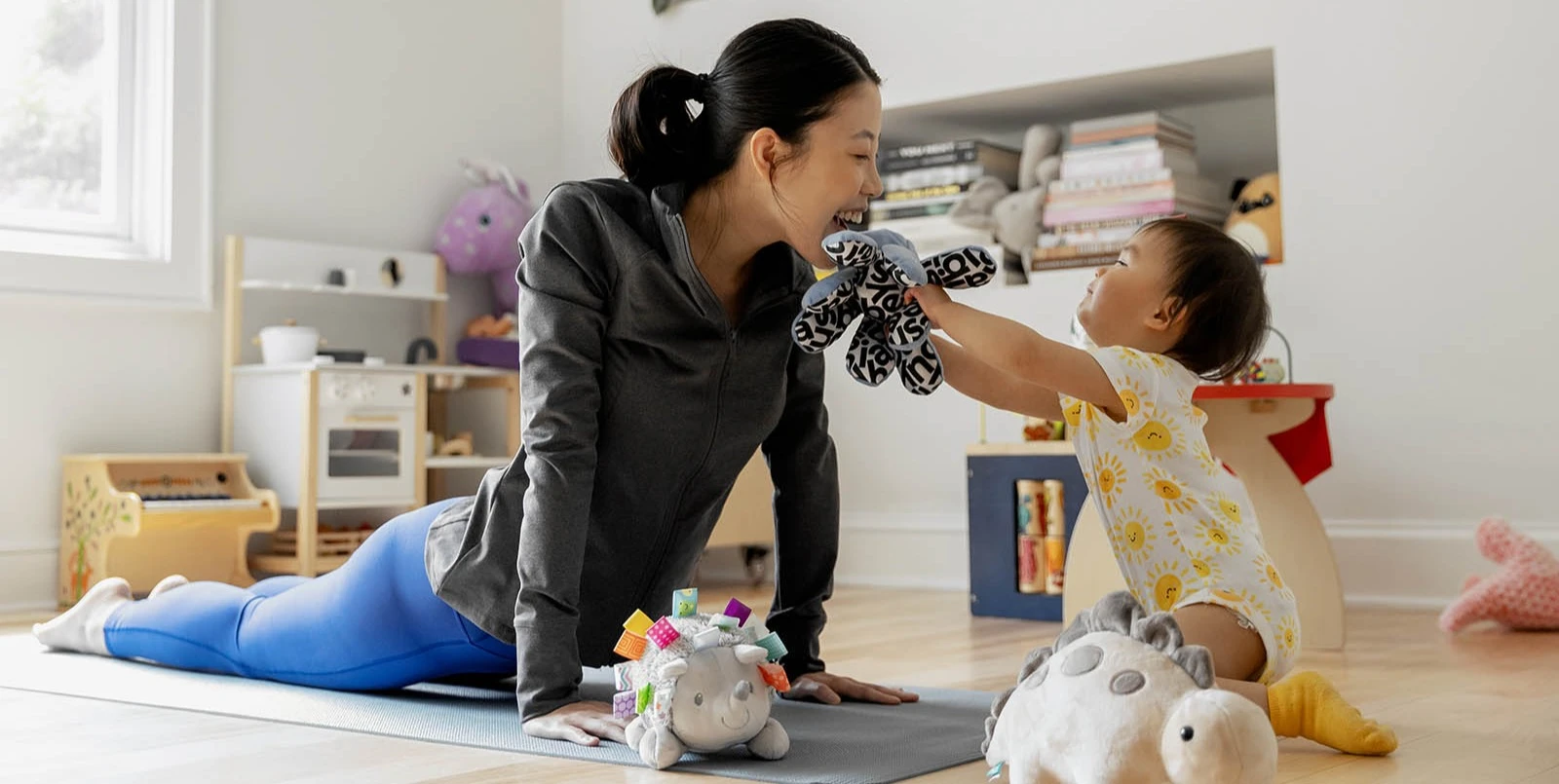 Mother and daughter playing with toys