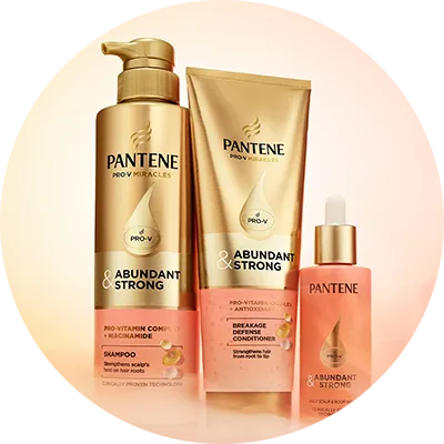 Pantene Abundant & Strong shampoo, conditioner, and serum are arranged on a light background