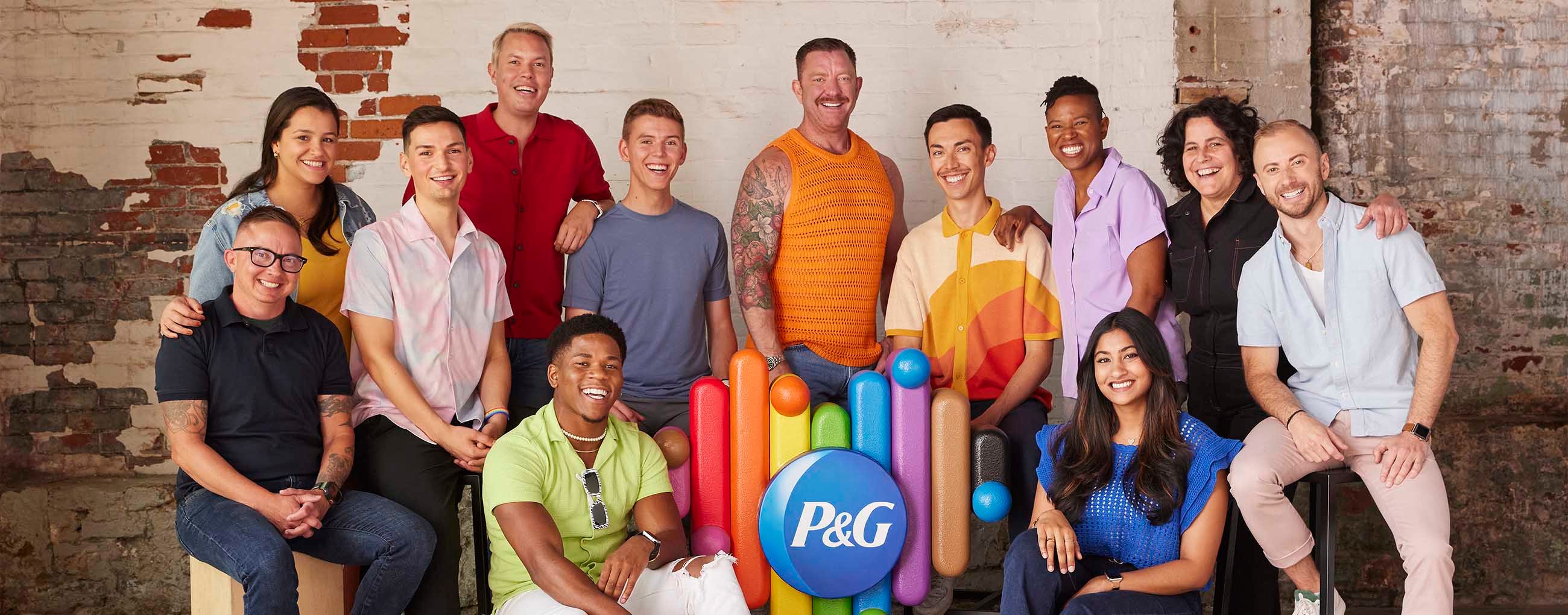 P&G employees around P&G pride logo