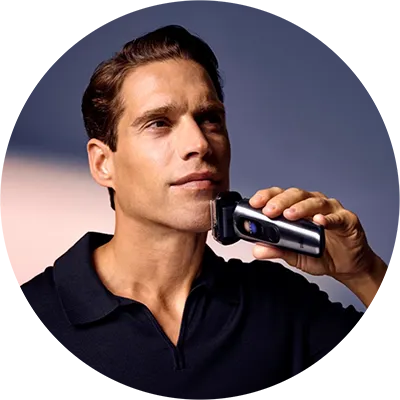 A man uses the Braun NEVO electric shaver on his face, showing how the device glides across the skin for a smooth, comfortable shave.
