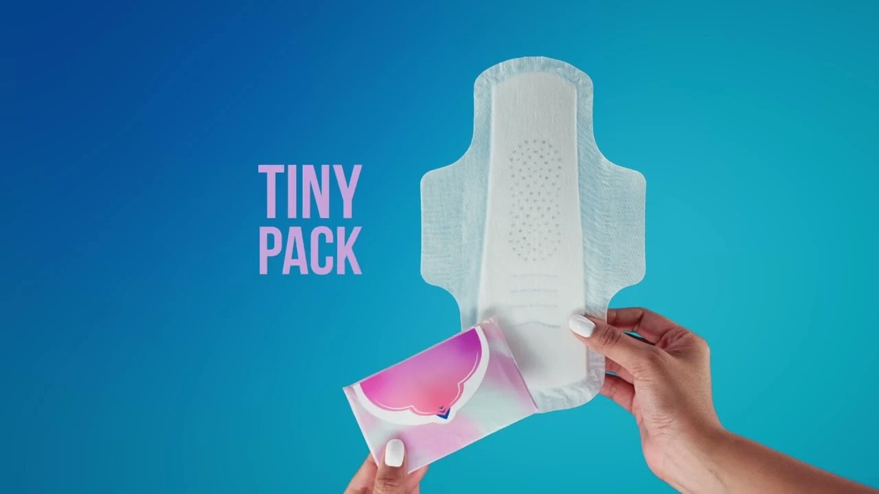 Hand holding a Always Pocket Flexfoam period pad with text 'Tiny Pack' next to it.