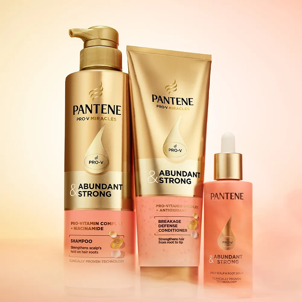 Pantene Abundant & Strong shampoo, conditioner, and serum are arranged on a light background