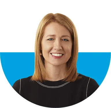 Chief Legal Officer and Secretary Susan Street Whaley wearing a black top and smiling