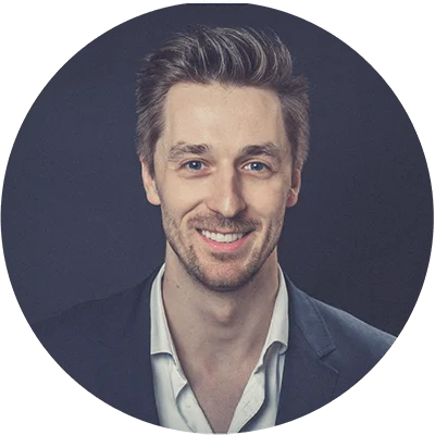 Headshot of a white male in a suit jacket.