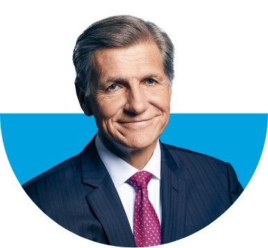 Chief Brand Officer Marc Pritchard wearing a blue suit and purple tie with small white dots