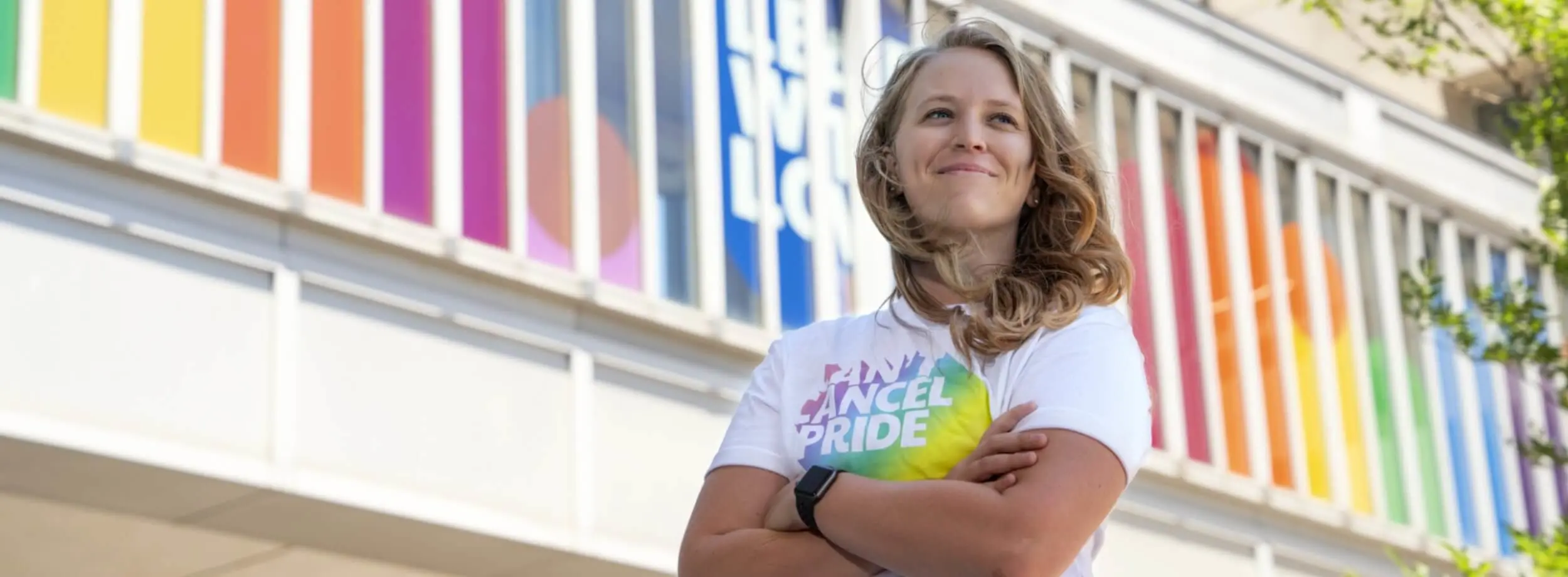 Person in Can’t Cancel Pride t-shirt at Cincinnati GO which is decorated with a rainbow and the words “Lead with Love”. 