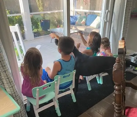 Kelley’s four children partaking in window art