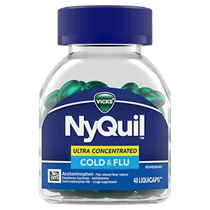 Clear bottle of NyQuil LiquiCaps with a blue lid. Shiny blue capsules in the bottle are visible above a dark blue label. 