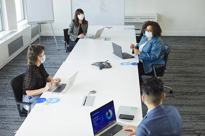 P&G employees sitting in a conference room