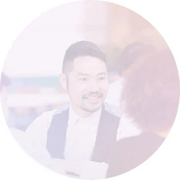 asian man sitting in diverse surroundings