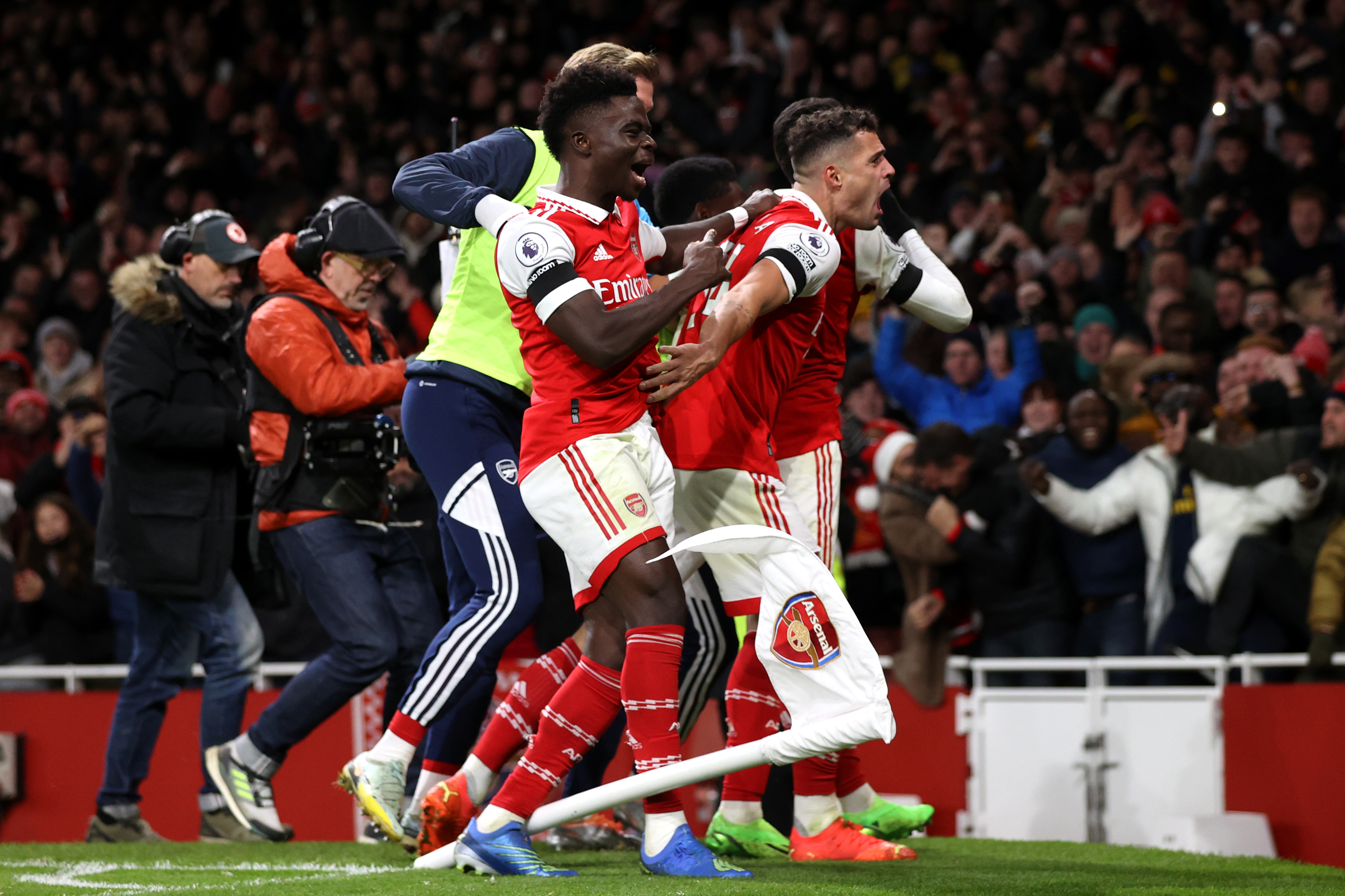 Gabriel Martinelli of Arsenal celebrates with team-mates Bukayo Saka and Granit Xhaka 