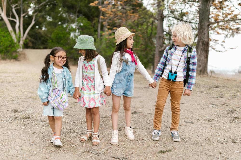 Four girls holding hands