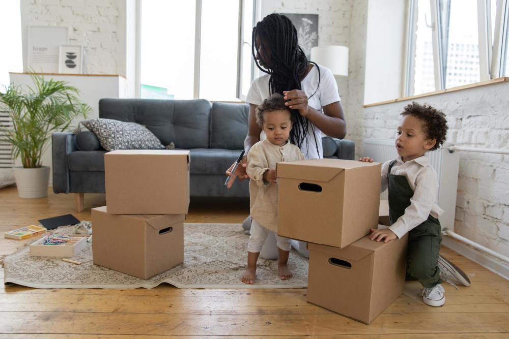 Mom and kids with moving boxes