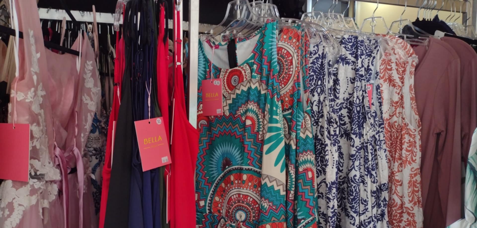 Prom dresses 2025 Pequot Lakes MN - Romantic floral and jewel tone formal gowns for Brainerd Lakes area high school proms at Bella's Dresser boutique