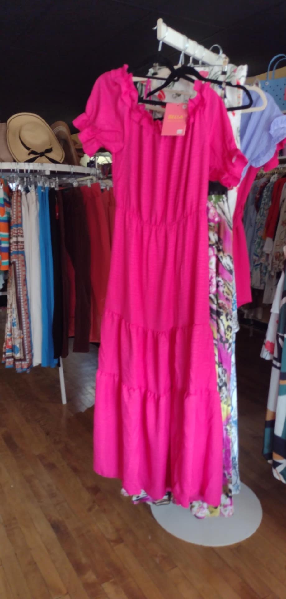 Summer dress styles 2024 - Bella's Dresser boutique owner modeling elegant maxi dress perfect for Gull Lake vacations and Breezy Point Resort dinners in Pequot Lakes MN