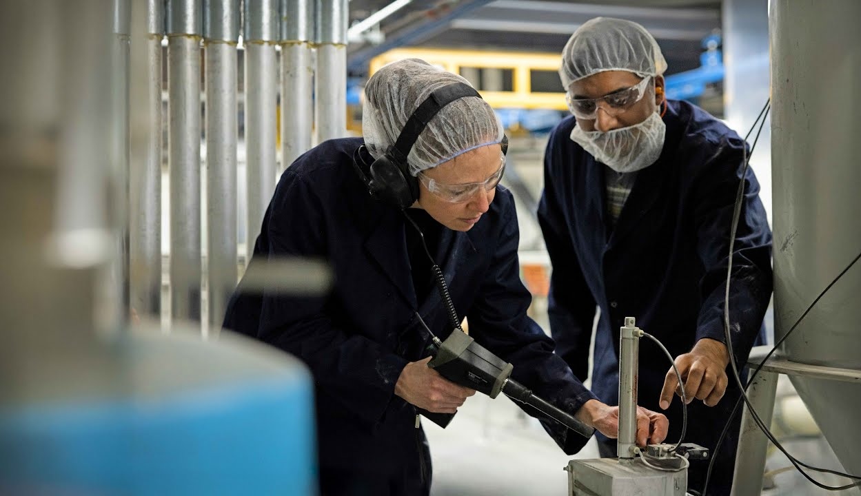 Two Efficiency Nova Scotia Energy Managers examining Emmerson Packaging's facility.