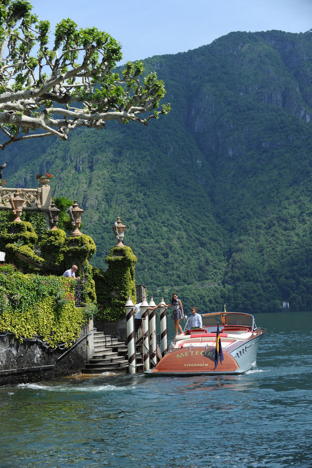 A J Craft Torpedo moored against the mountain shoreline of Lake Como.