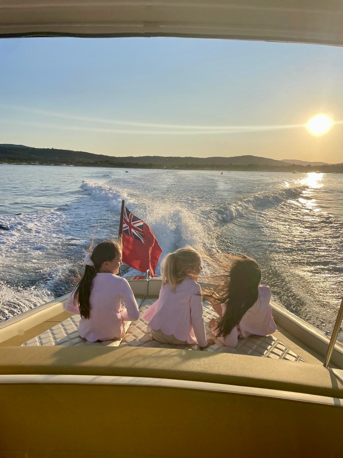 Anya Brunander’s daughters aboard BABEBI at sunset.