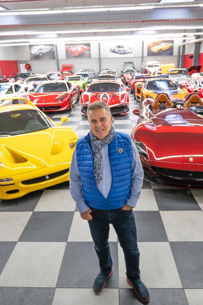Jacques Sicotte among his cars.