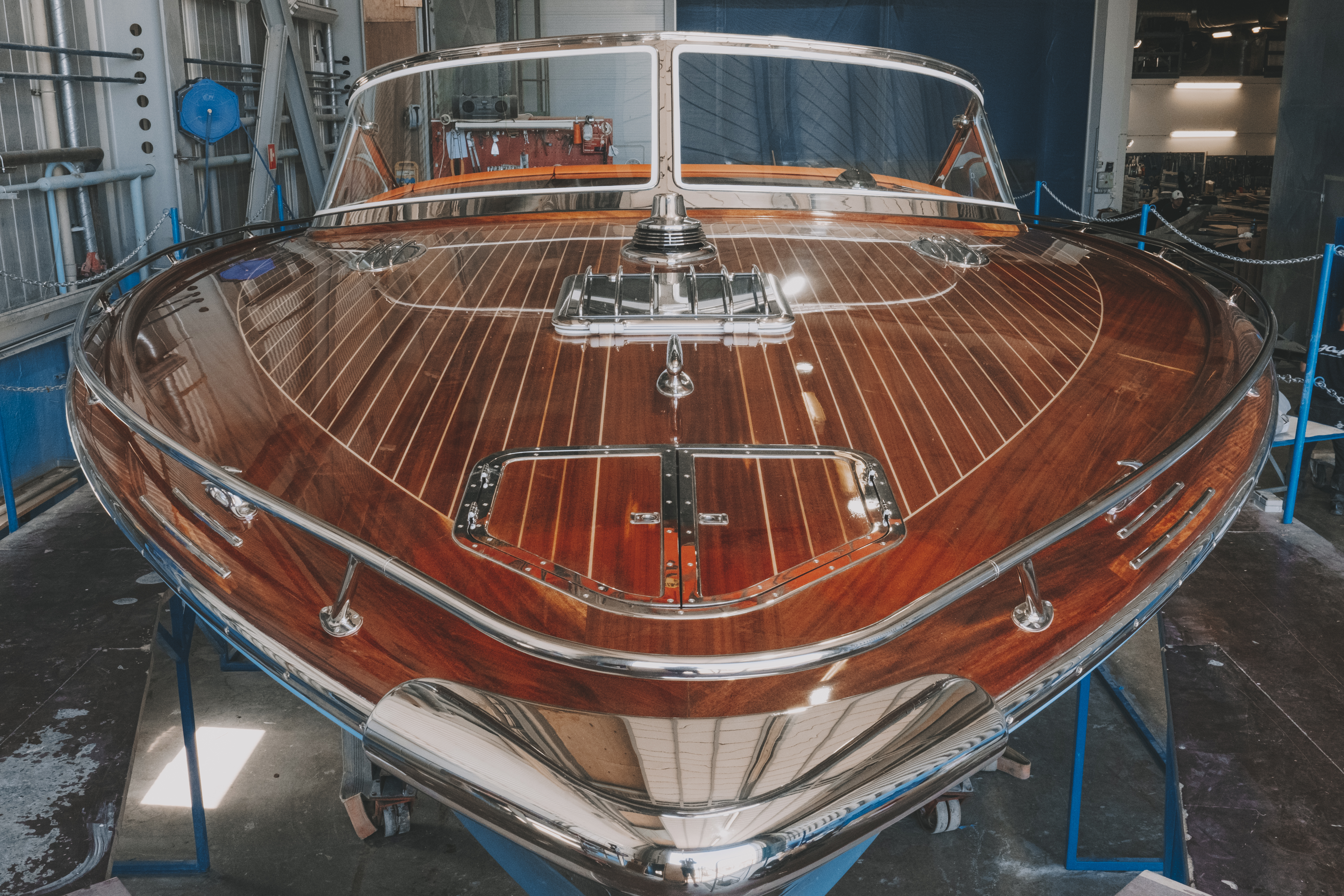 J Craft Torpedo on workshop cradle at the Gotland shipyard, mahogany hull and chrome fittings gleaming under construction