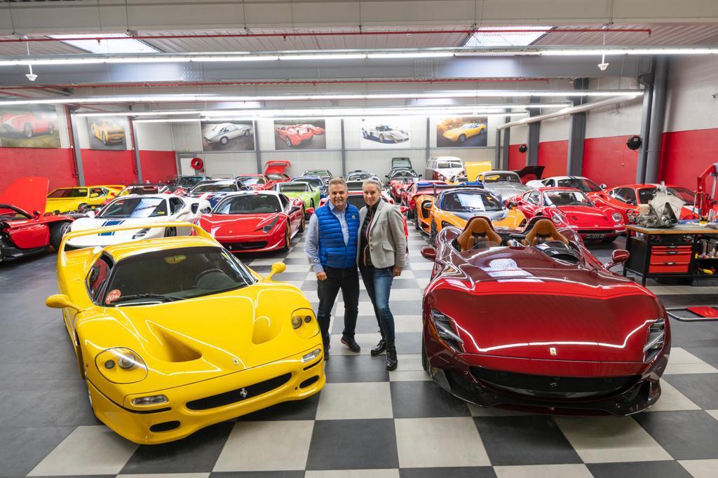 Jacques Sicotte and his wife Linda with the Ferrari collection he has built 