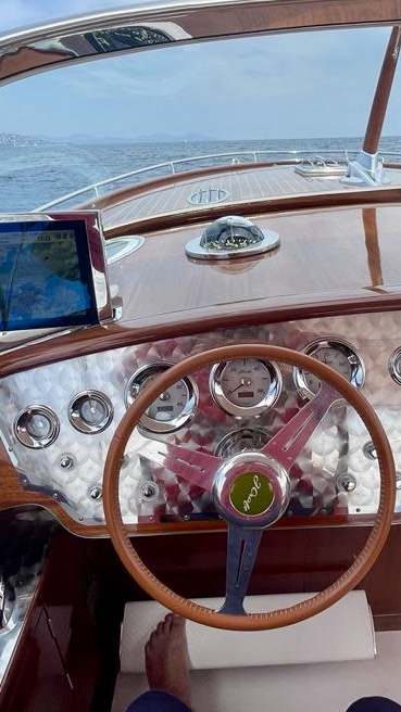 Temptation’s Nardi wheel, rose polished steel dashboard and fully retractable Garmin plotter.