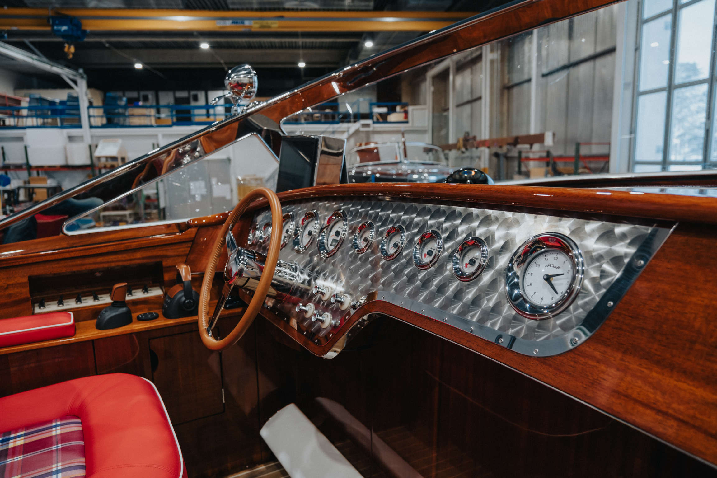 J Craft Torpedo cockpit with rose-polished steel dashboard, chrome gauges, leather steering wheel and red upholstery
