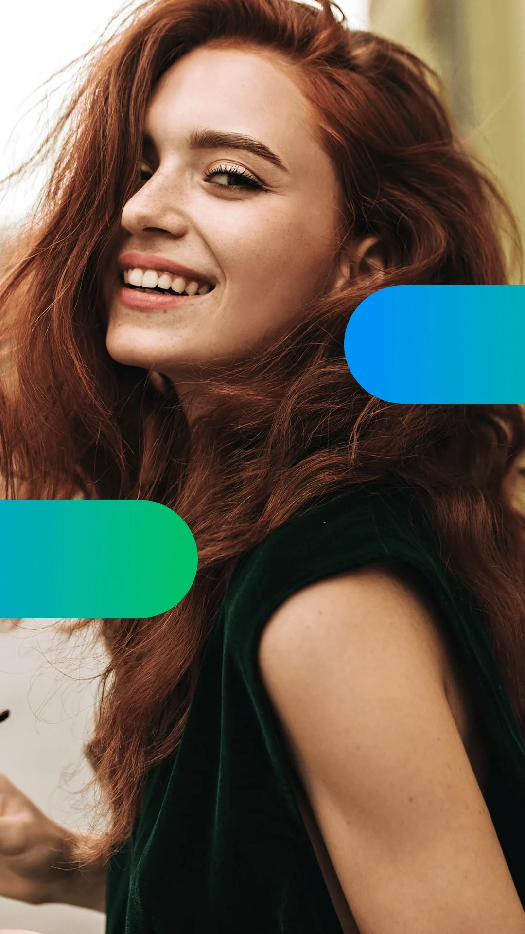 Person smiling, showcasing voluminous hair indoors.