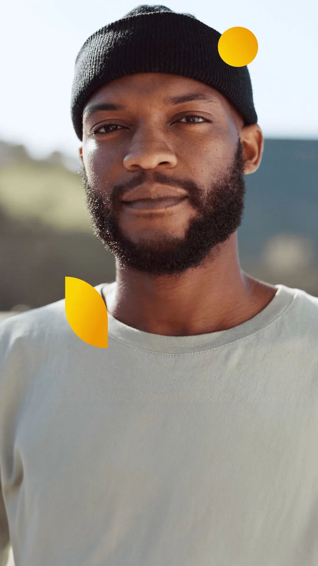 Portrait of a bearded man wearing a black hat.