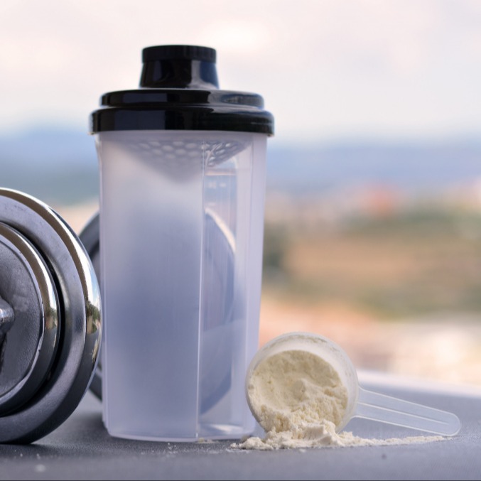 Whey shaker with a dumbbell