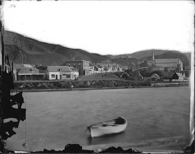 Intersection of Thorndon Quay and Mulgrave Street, photographed by William Henry Whitmore Davis in 1866. The Thistle Inn can be seen in the centre-left of the image, and Old St Paul’s Cathedral on the right.
