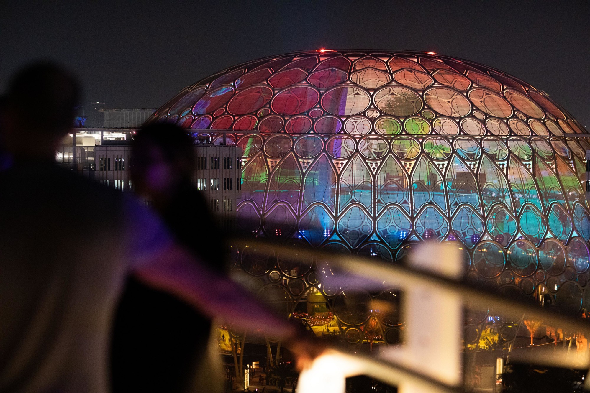Visitors watch Al Wasl Dome turn blue for World Children’s Day from Garden in the Sky Web Image m12194