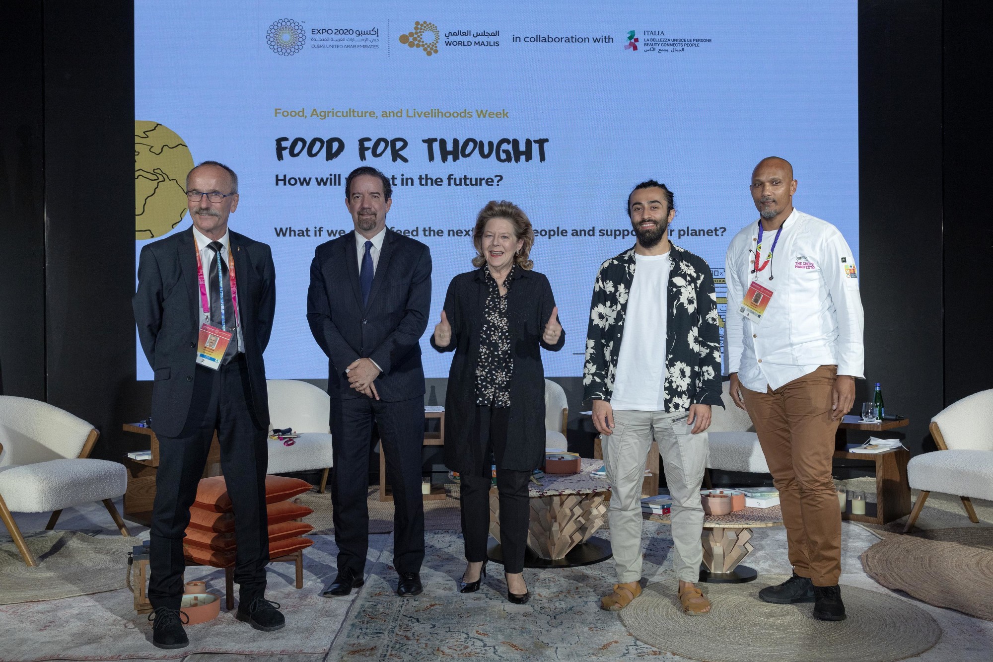 A group photo of Eithne Treanor (C), Moderator, Managing Director of E Treanor Media, Chef Coco Reinarhz (R1), International Chef and Restauranteur, Amin Emadi (R2), Food and Agriculture Organisation, Switzerland, Dr Celso Moretti (L2), CEO,