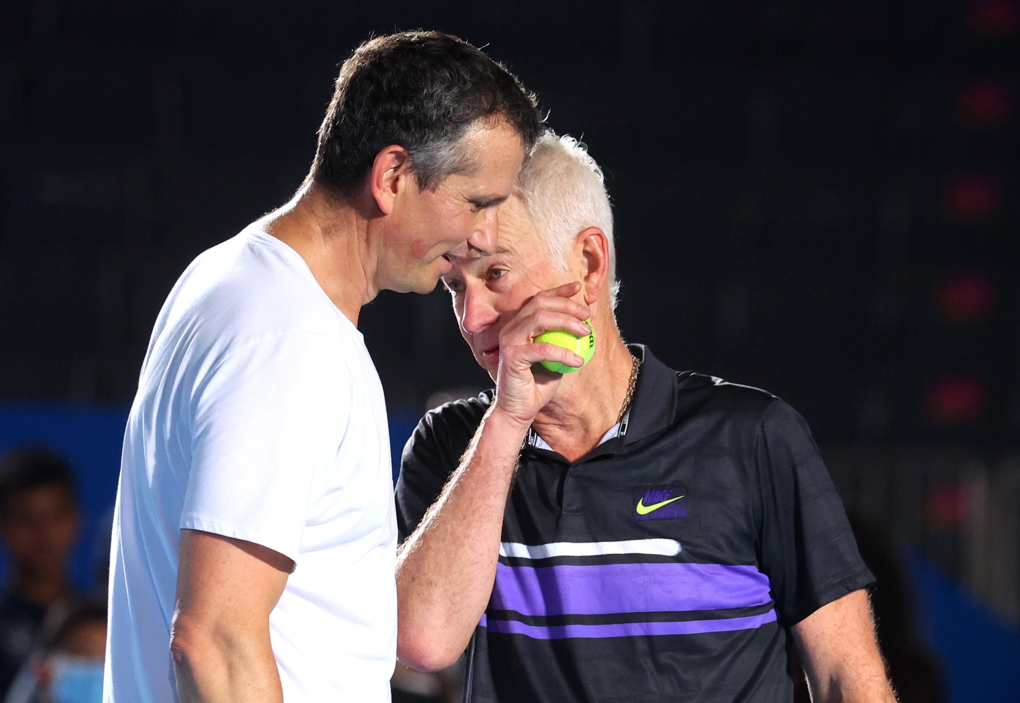 Tennis legends John McEnroe (R) and Richard Krajicek talk during the Men’s Doubles Exhibition Game against Mark Philippoussis and Greg Rusedski for Expo 2020 Dubai Tennis Week at the Expo Sports Arena m52446
