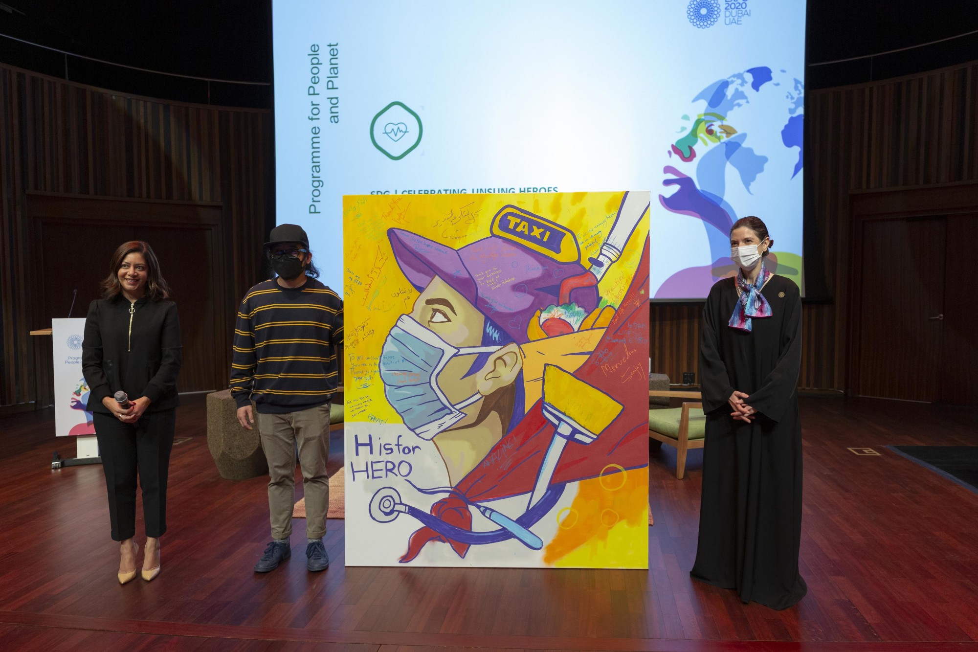 Dr Maha Barakat (R), Director General of the Frontline Heroes Office and Cholo Juan (C), Filipino Visual artist during Celebrating the Unsung Heroes at Terra the Auditorium m39240