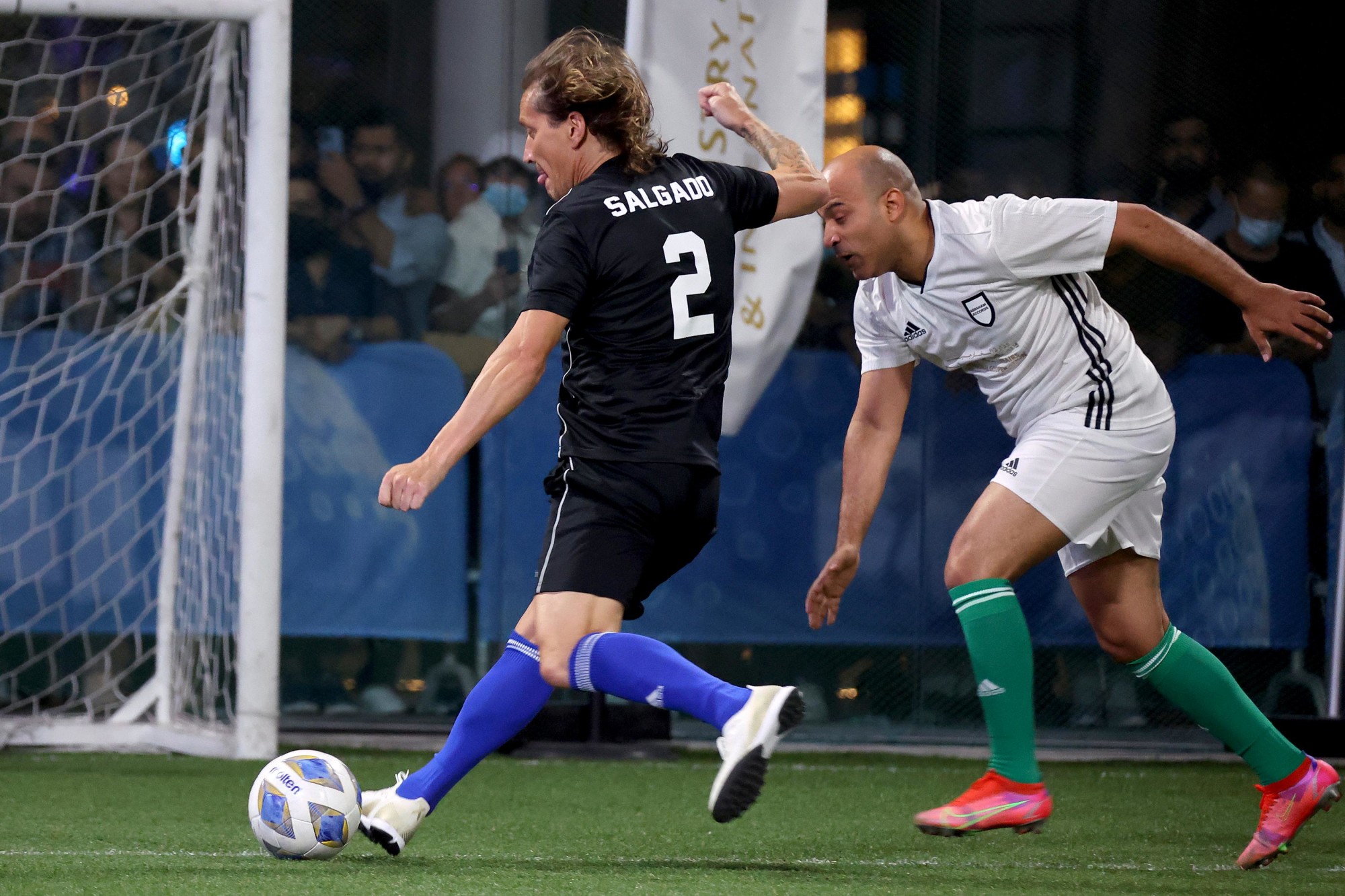 Spanish former footballer and World Classic team member Míchel Salgado (L) in action against Israeli footballer and Abraham Accords team member Tal Ben Haiman (R) during an exhibition match for the Abraham Accords Games at the Sports, Fitne