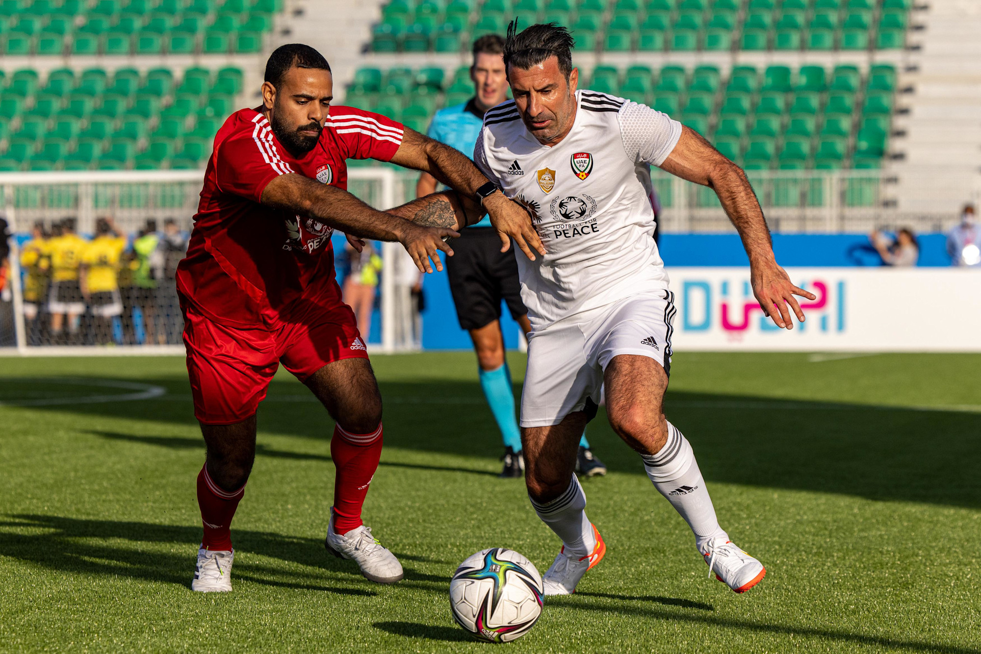 Luis Figo (R), of Team Salgado in action during the UAE All Stars Football tournament at the Expo Sports Arena m30744