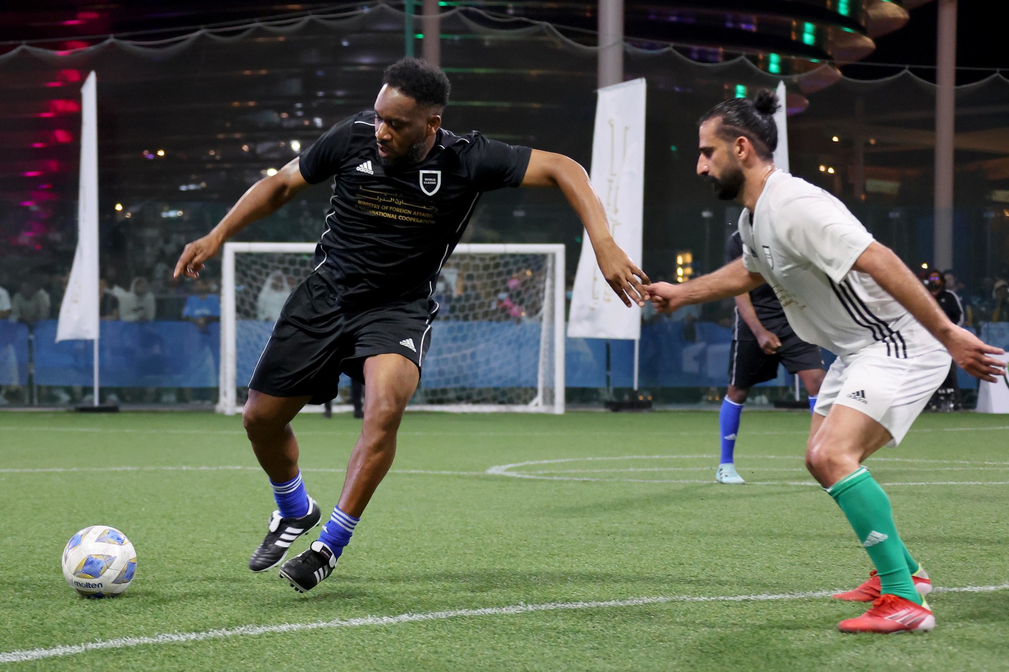 Nigerian former footballer and World Classic team member Jay Jay Okocha (L) in action during an exhibition match against the Abraham Accords team for the Abraham Accords Games at the Sports, Fitness and Wellbeing Hub m70770