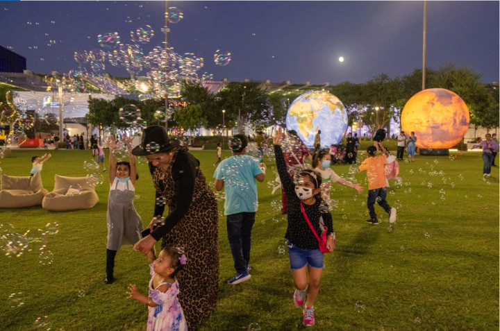 Visitors at the Two Planets exhibit during the Kaleidoscope Light Show Al Forsan Park Original Image m5224