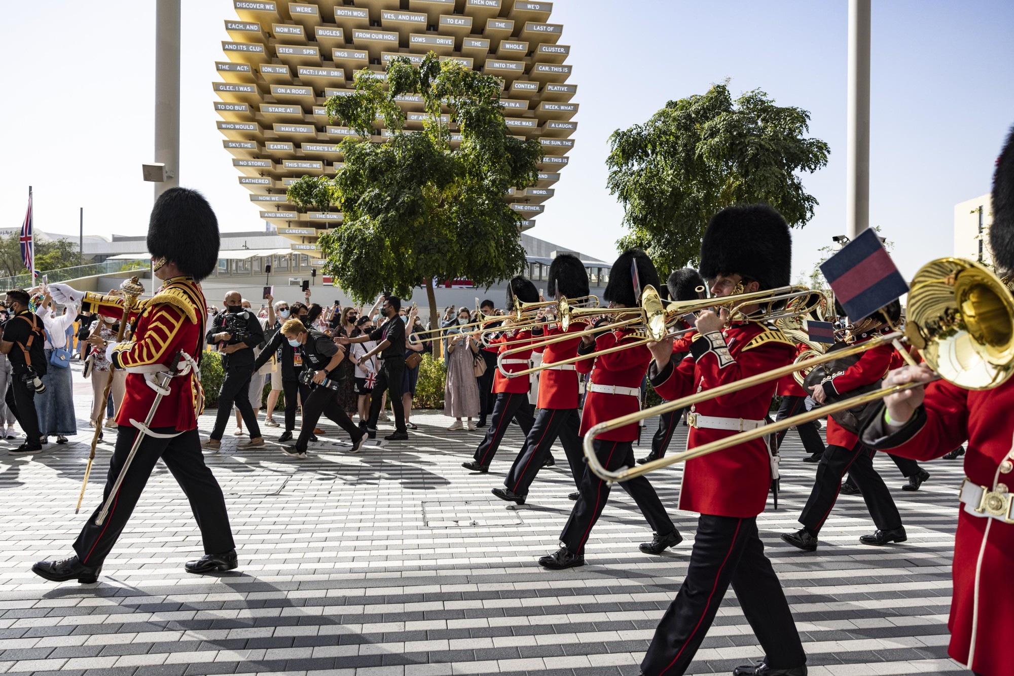The Coldstream Guards parade past the United Kingdom Pavilion during the United Kingdom National Day Celebrations m46316