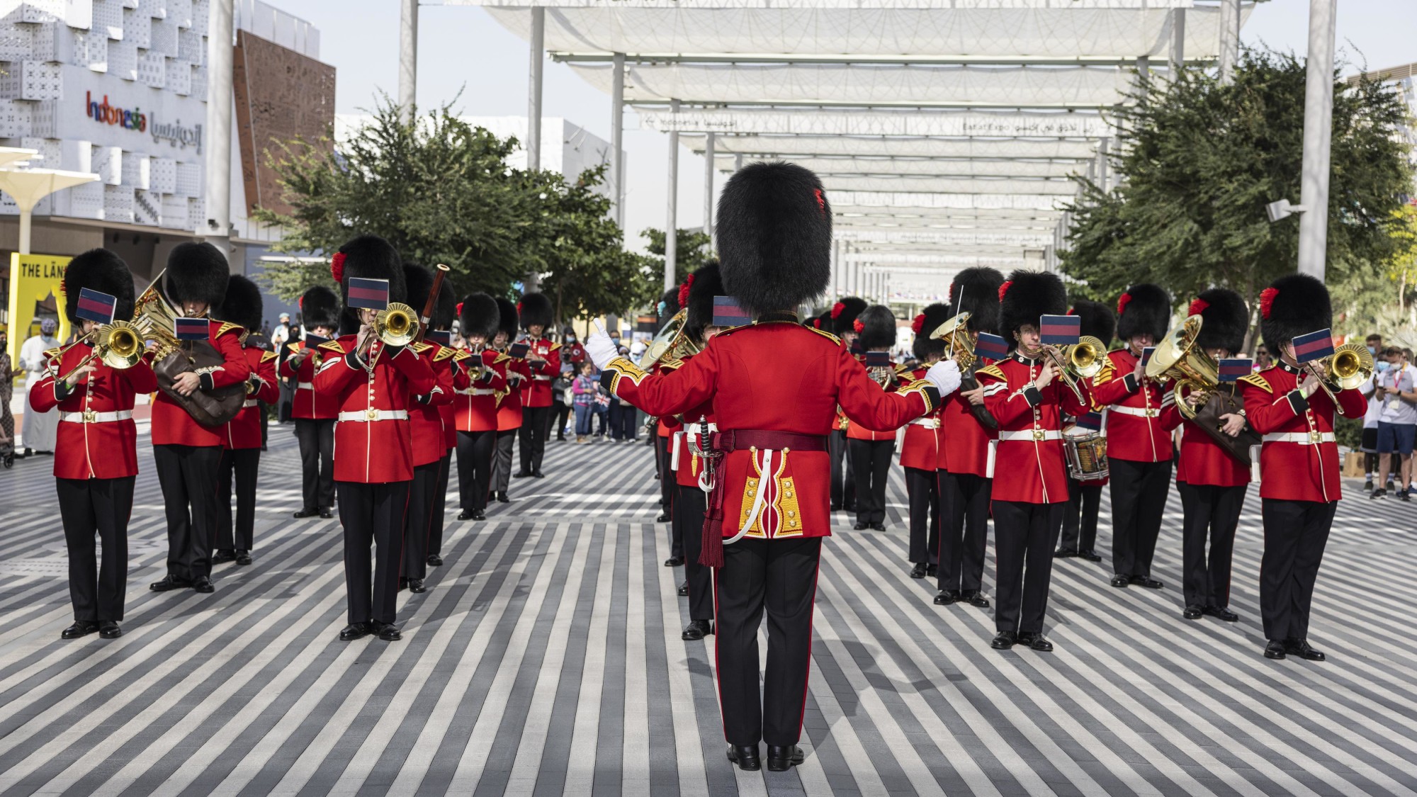 The Coldstream Guards parade past the United Kingdom Pavilion during the United Kingdom National Day Celebrations m46314