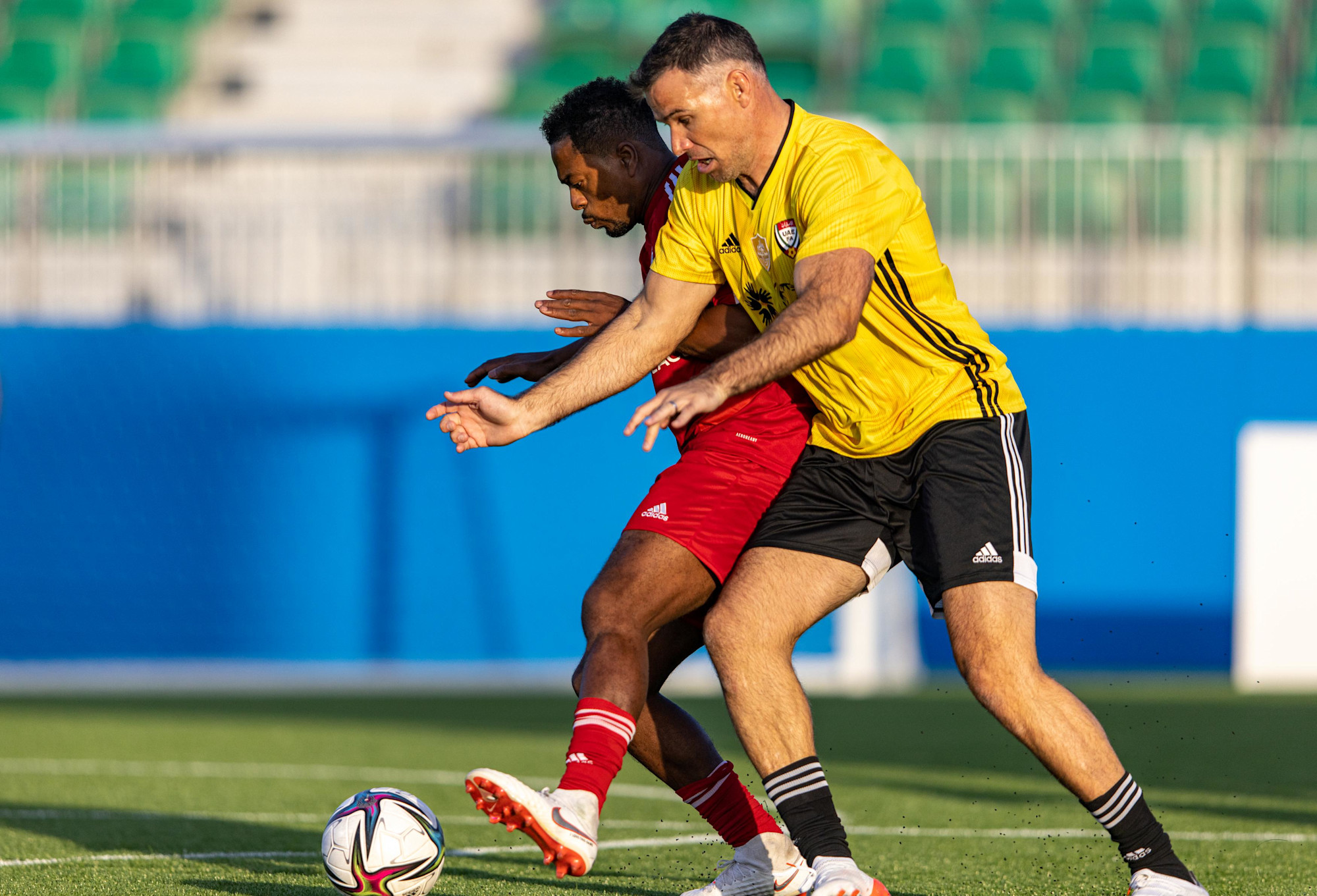 Patrice Evra (L), of Team Patman in action during the UAE All Stars Football tournament at the Expo Sports Arena m30757