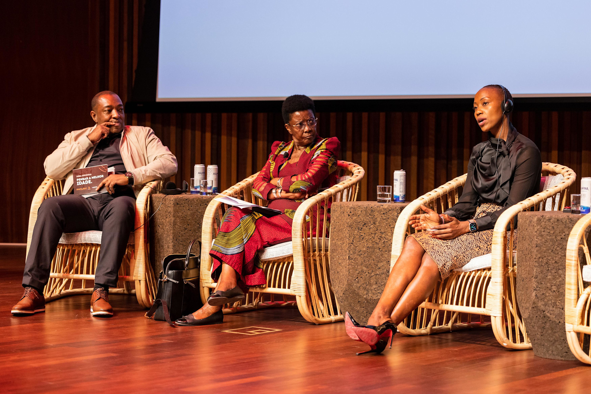 Daniel Nascimento ((L), Dr Deolinda Bebiana de Almcida (C) and Miss Abigael Wanjiru (R) during the Pensar a Melhor Idade Thinking about the best age panel discussion at Terra Auditorium m45549