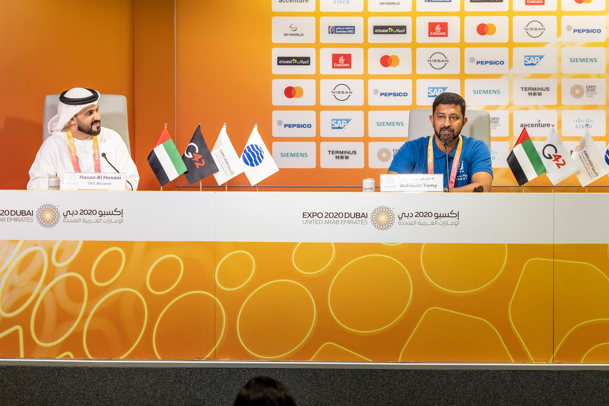 Hasan Al Hosani (L), CEO of Bayanat and Commander Abhilash Tomy (R), retired Indian Naval Officer, Yachtsman and first Indian to complete a solo, non-stop circumnavigation of the world under sail, speak during a G42 Press Conference to annou