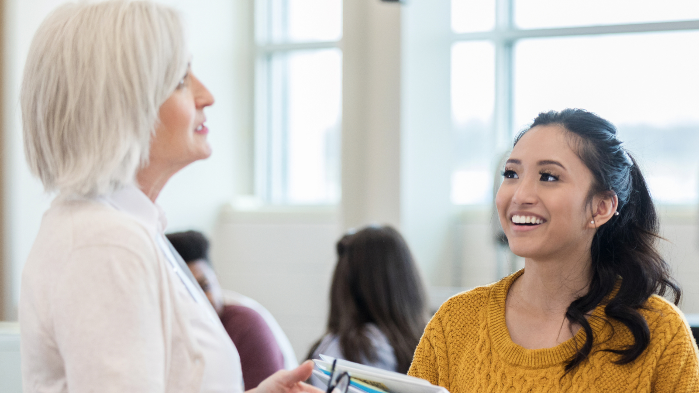 Mentor teacher talking to student teacher.