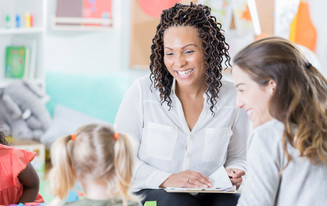 A mentor teacher and student teacher are working with a student.