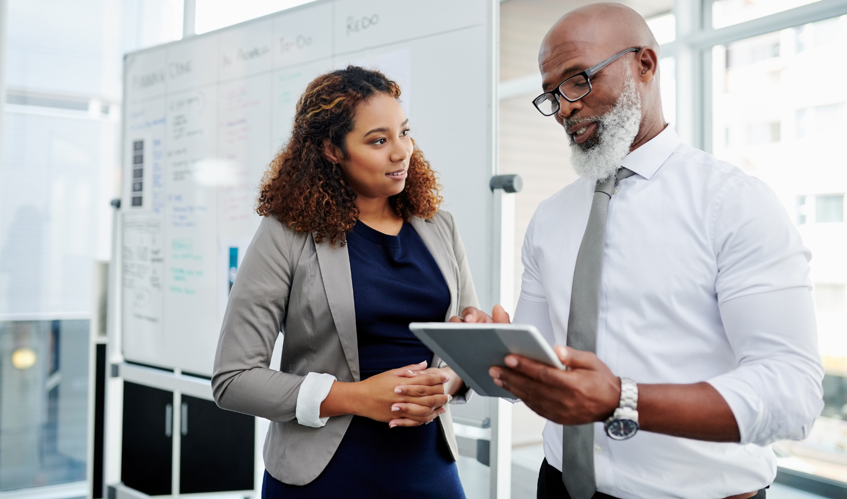 An African-American mentor mentoring an African-American mentee in a DEI mentoring program.